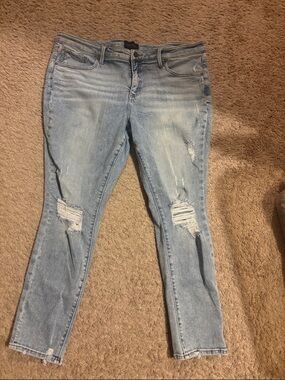 Buckle Light Wash Ripped Skinny Jeans